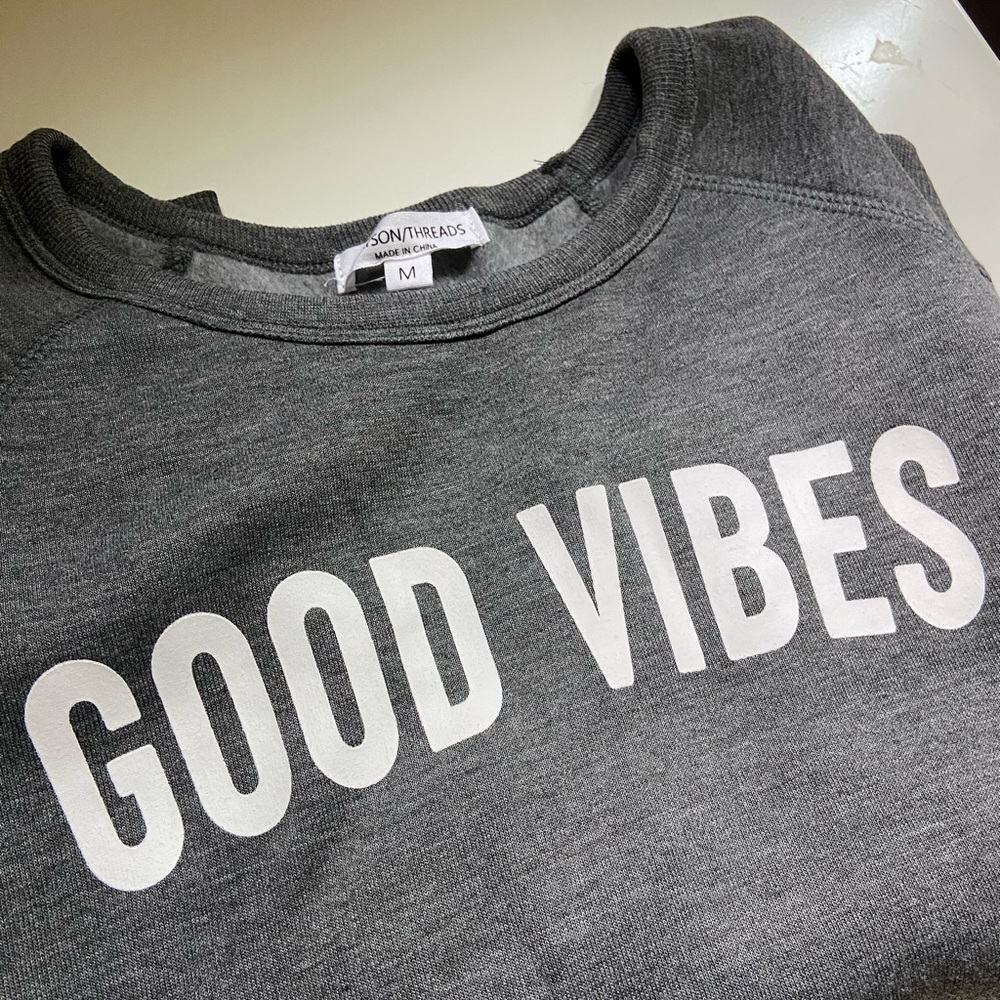 Gray “good vibes” sweatshirt; never worn; size M